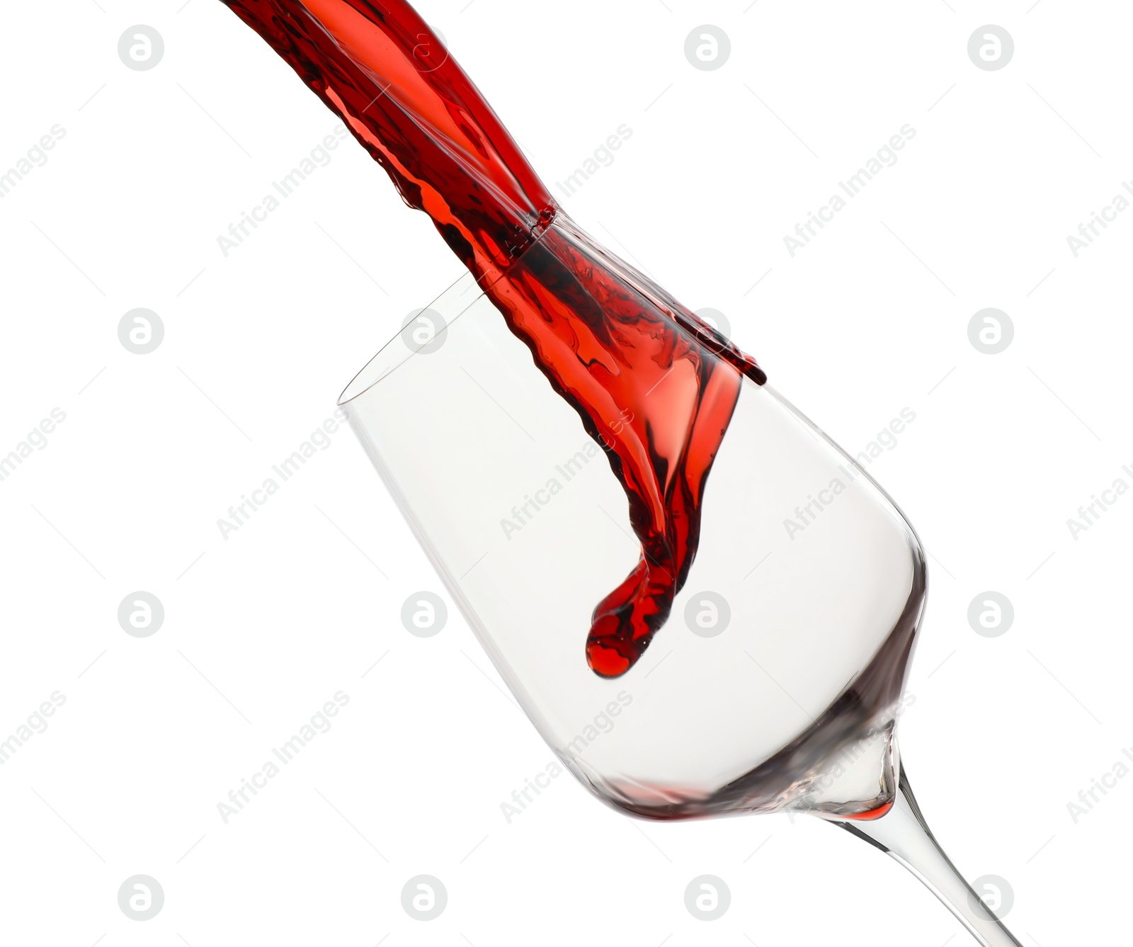 Photo of Pouring red wine into glass isolated on white