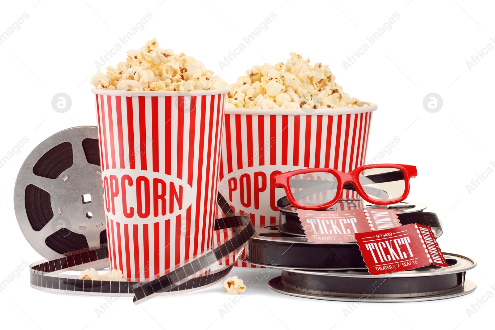 Photo of Tasty popcorn, film reels, glasses and movie tickets isolated on white