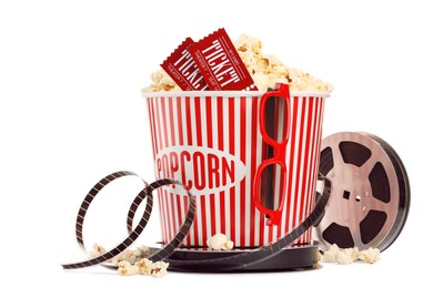 Photo of Tasty popcorn, film reel, glasses and movie tickets isolated on white