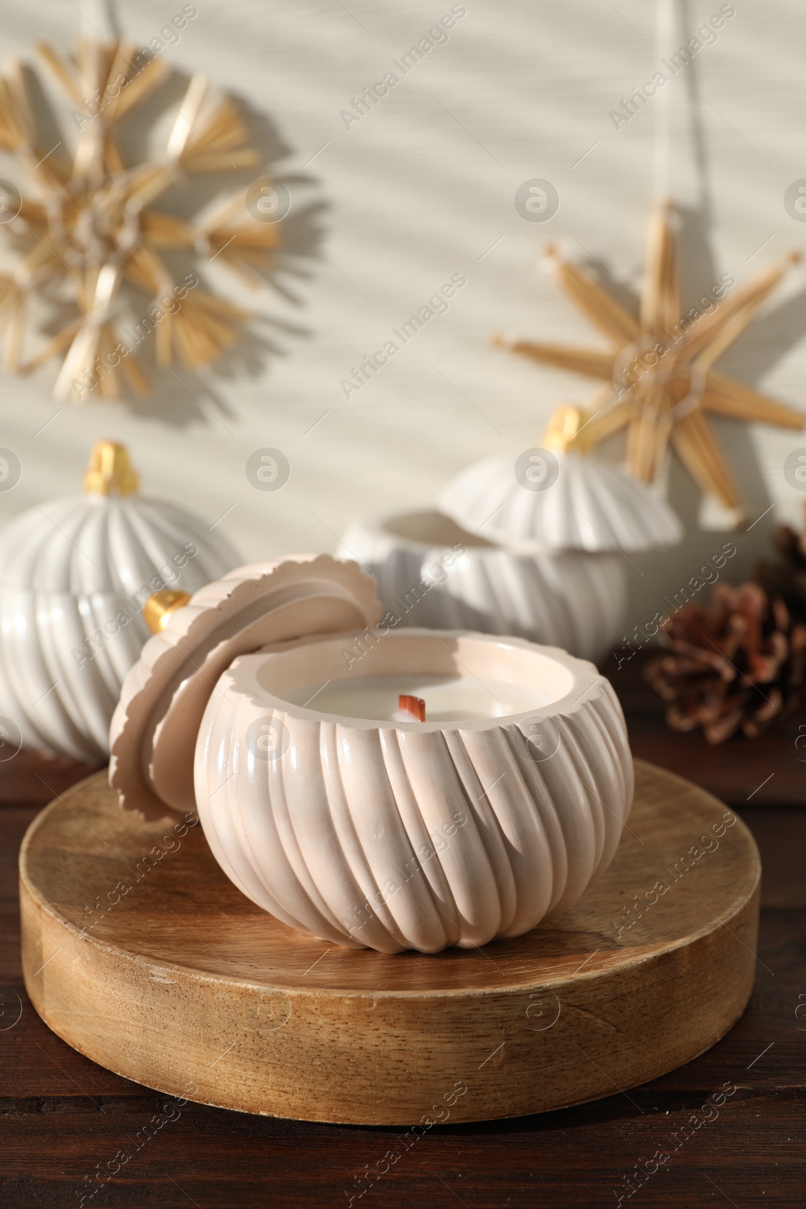 Photo of Soy wax candles on wooden table. Beautiful christmas decor