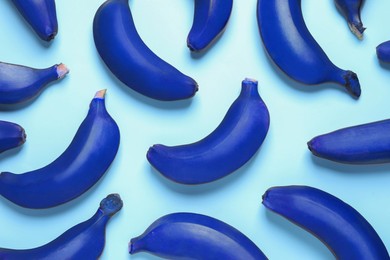 Image of Blue bananas on light background, flat lay