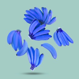 Image of Blue violet bananas in air on color background