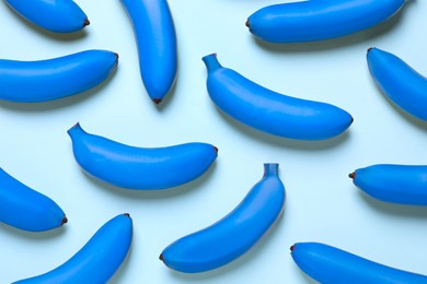 Image of Blue bananas on light background, flat lay