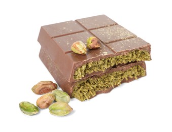 Photo of Pieces of tasty Dubai chocolate with pistachios and knafeh isolated on white