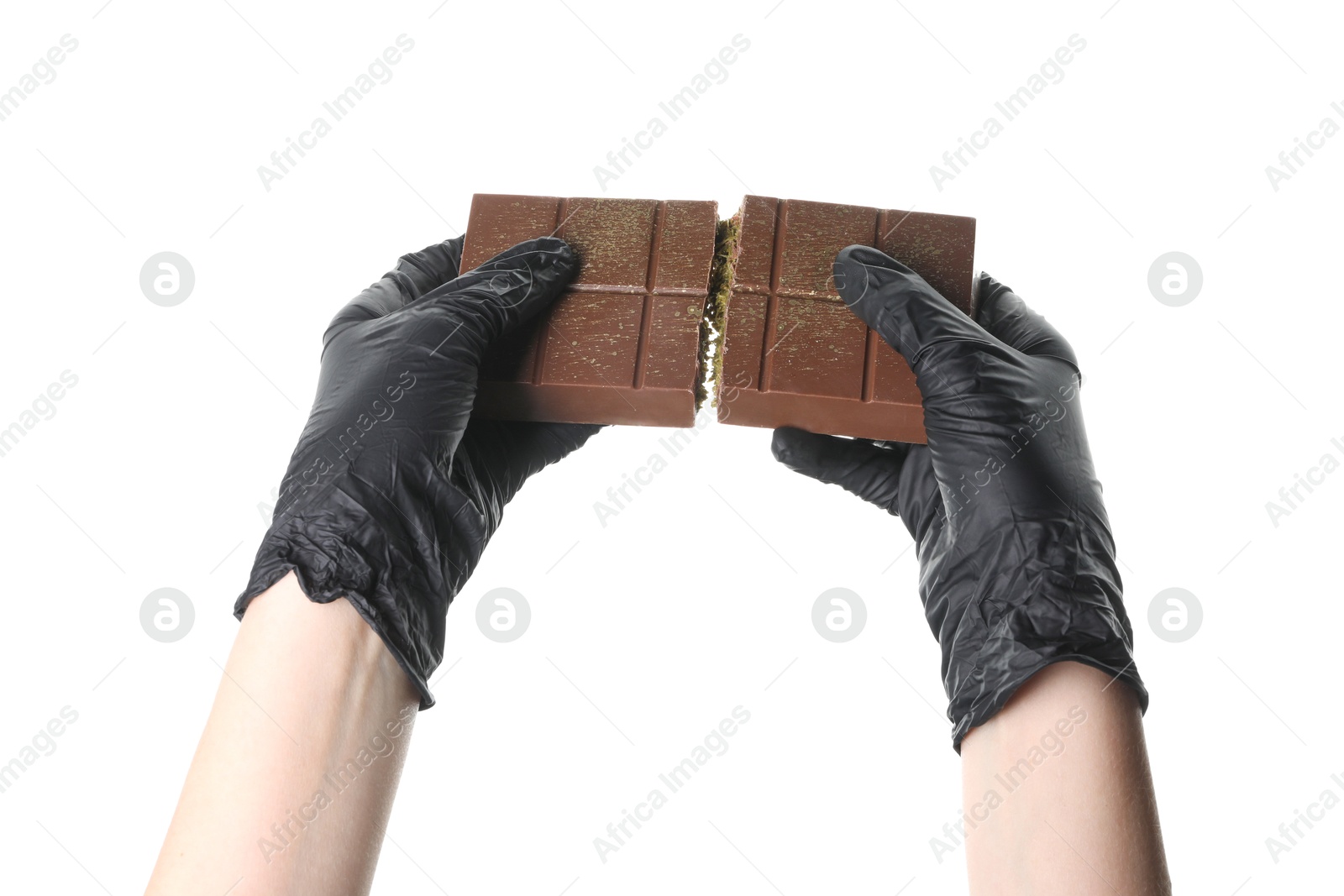 Photo of Woman holding pieces of tasty Dubai chocolate bar with pistachios and knafeh on white background, closeup