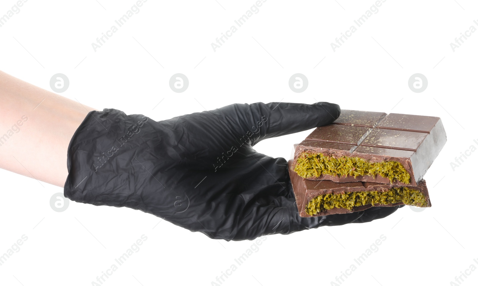 Photo of Woman holding pieces of tasty Dubai chocolate bar with pistachios and knafeh on white background, closeup