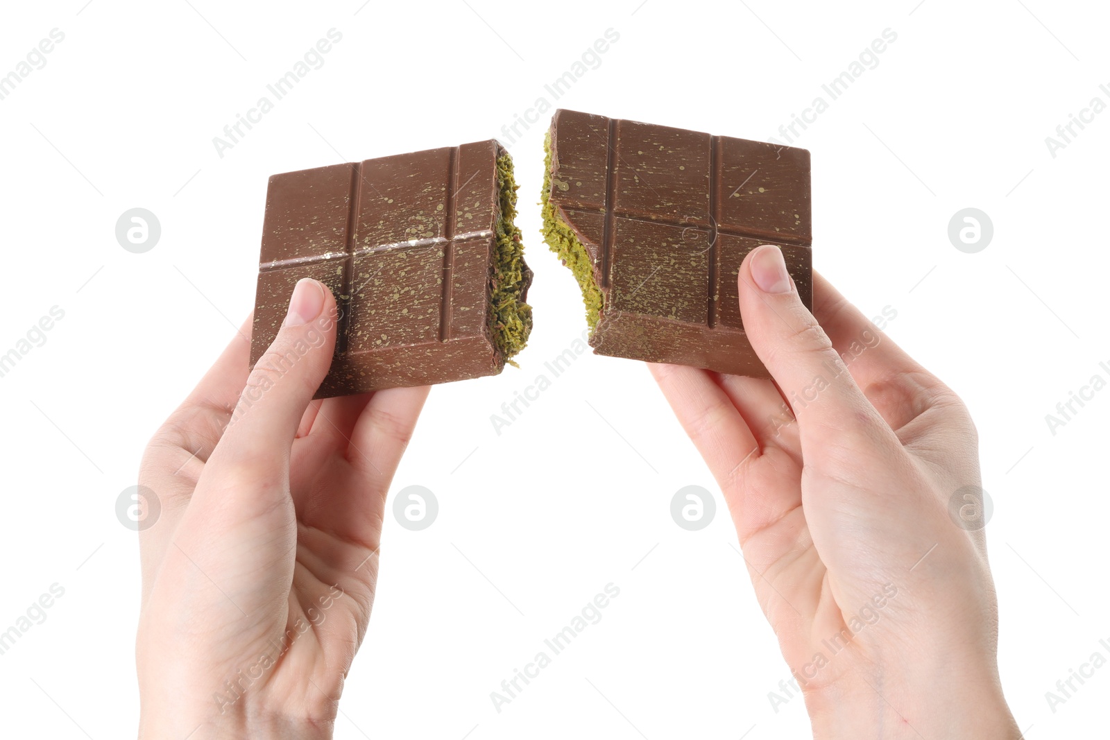 Photo of Woman breaking Dubai chocolate bar with pistachio and knafeh on white background, closeup