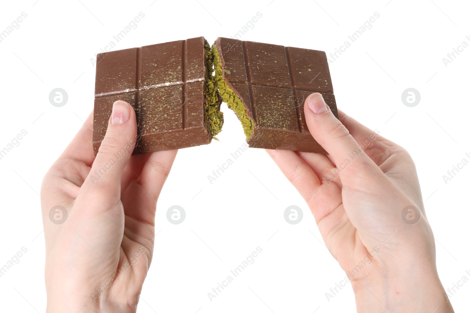 Photo of Woman breaking Dubai chocolate bar with pistachio and knafeh on white background, closeup