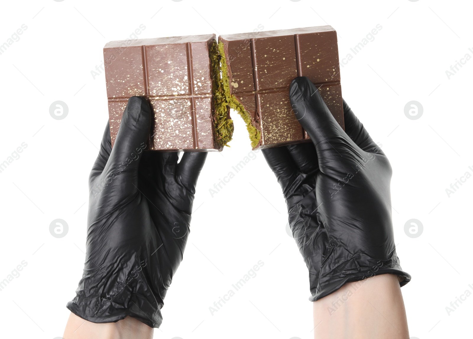 Photo of Woman breaking Dubai chocolate bar with pistachio and knafeh on white background, closeup