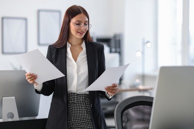 Photo of Portrait of banker with documents in office