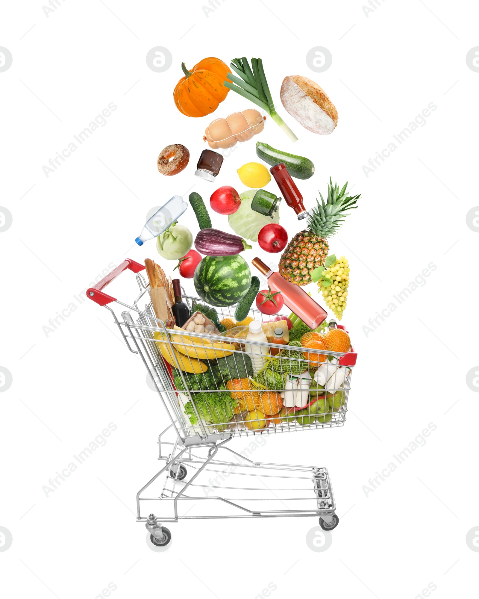 Image of Many different products falling into shopping cart on white background