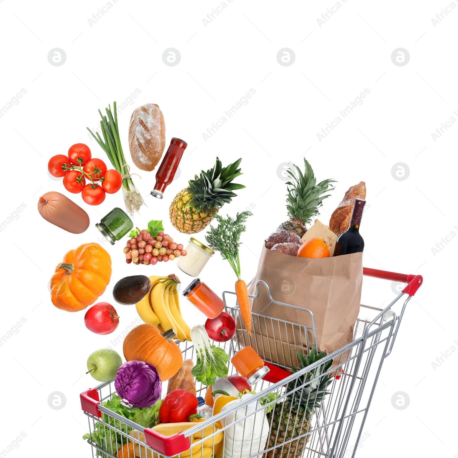 Image of Many different products falling into shopping cart on white background