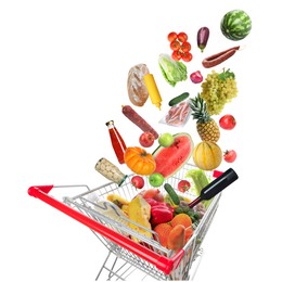 Image of Many different products falling into shopping cart on white background