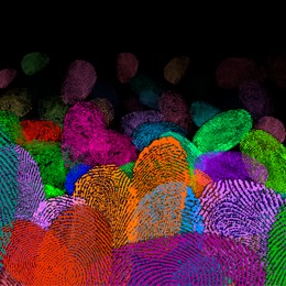 Image of Fingerprints of different colors on black background, space for text