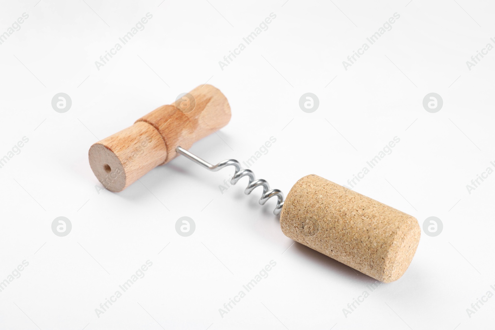 Photo of Corkscrew with wooden handle and cork on white background