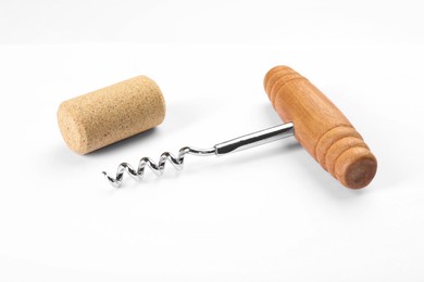 Corkscrew with wooden handle and cork on white background