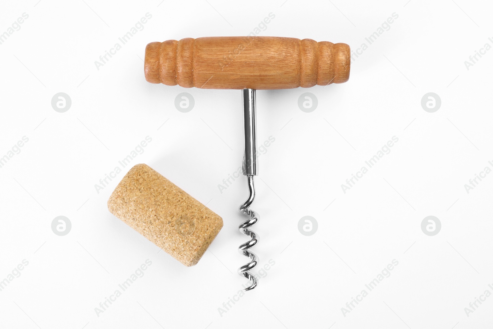 Photo of Corkscrew and cork on white background, top view