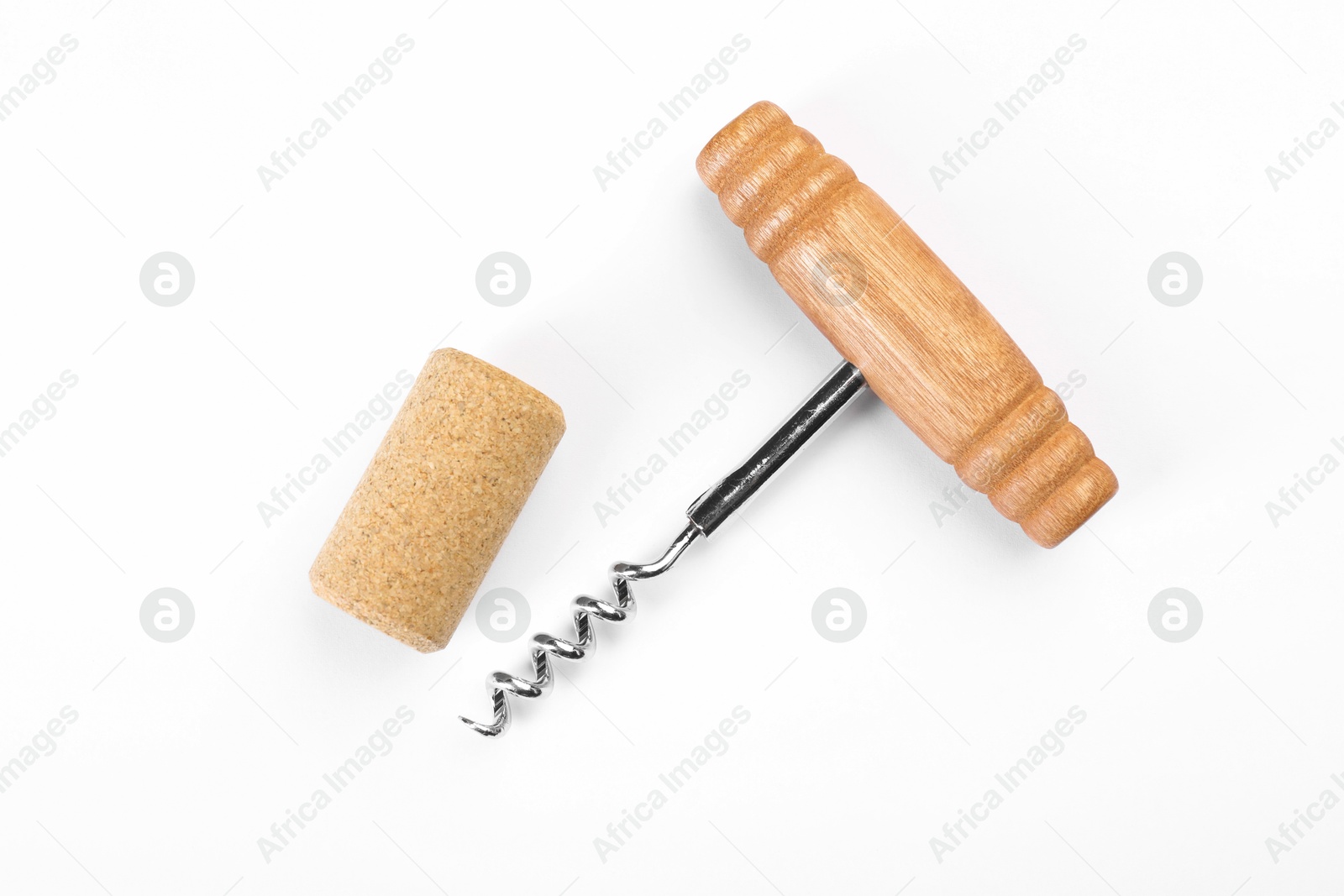 Photo of Corkscrew and cork on white background, top view