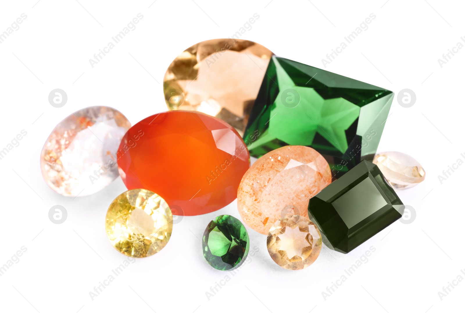 Photo of Different colorful shiny gemstones isolated on white