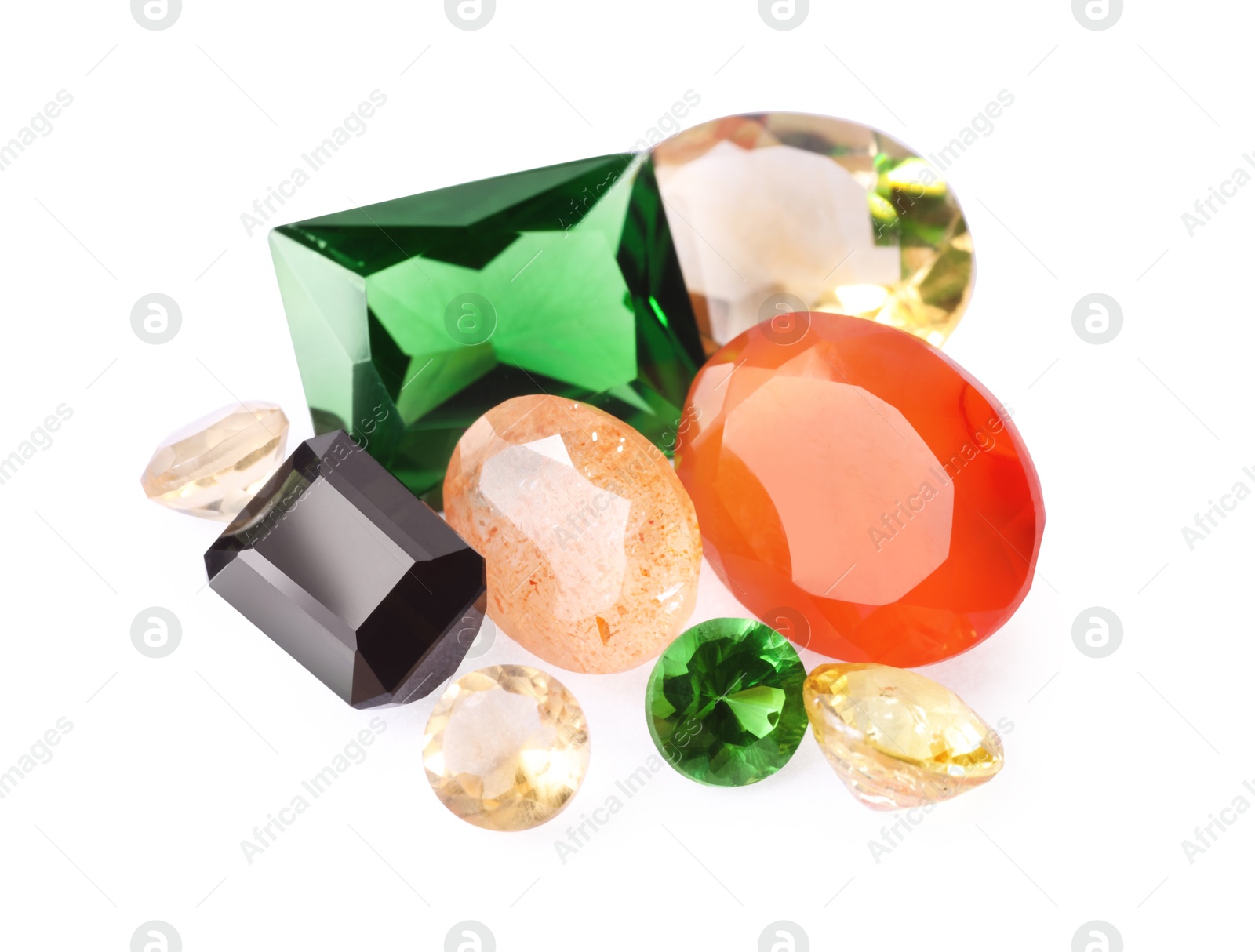 Photo of Different colorful shiny gemstones isolated on white