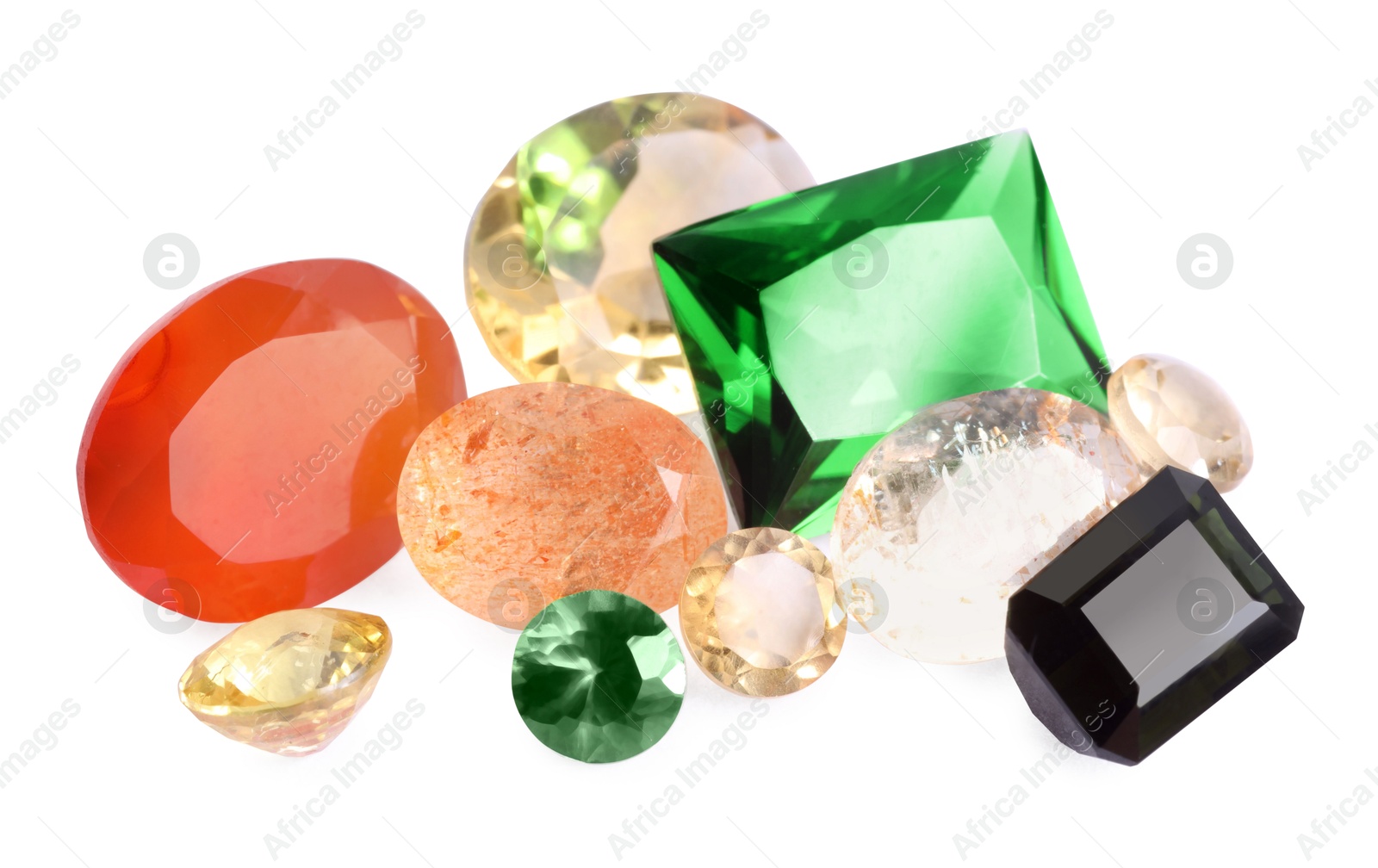 Photo of Different colorful shiny gemstones isolated on white