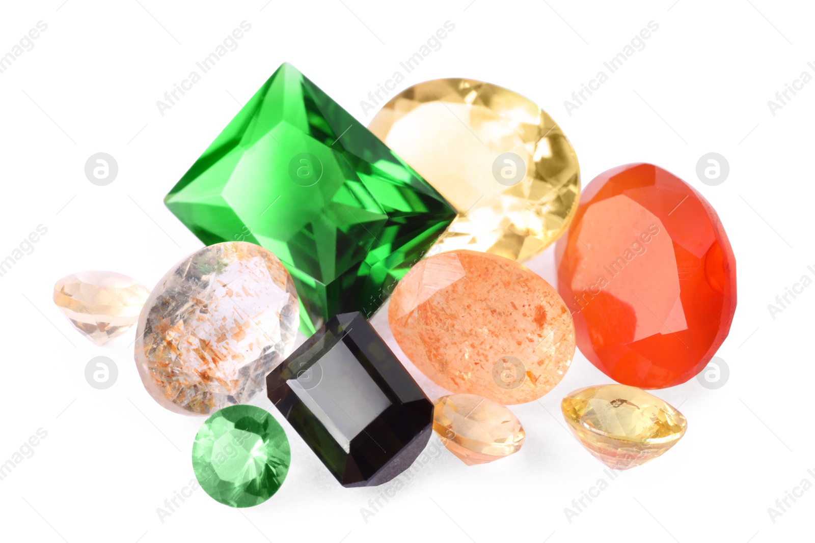 Photo of Different colorful shiny gemstones isolated on white