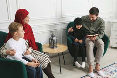 Photo of Happy Muslim family spending time together at home