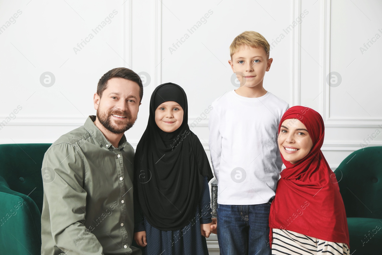 Photo of Happy Muslim family spending time together at home