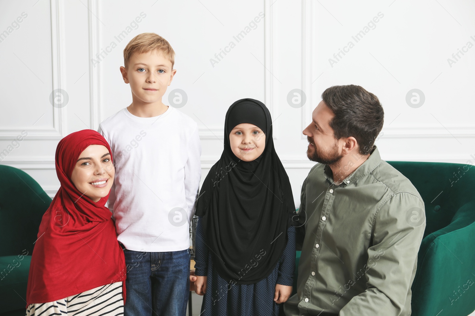 Photo of Happy Muslim family spending time together at home