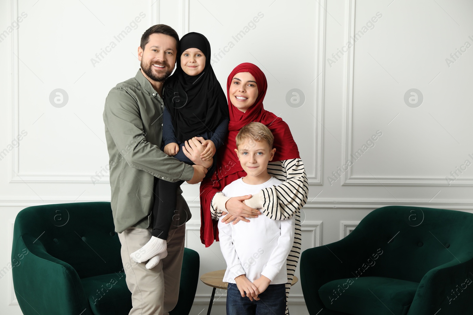 Photo of Happy Muslim family spending time together at home