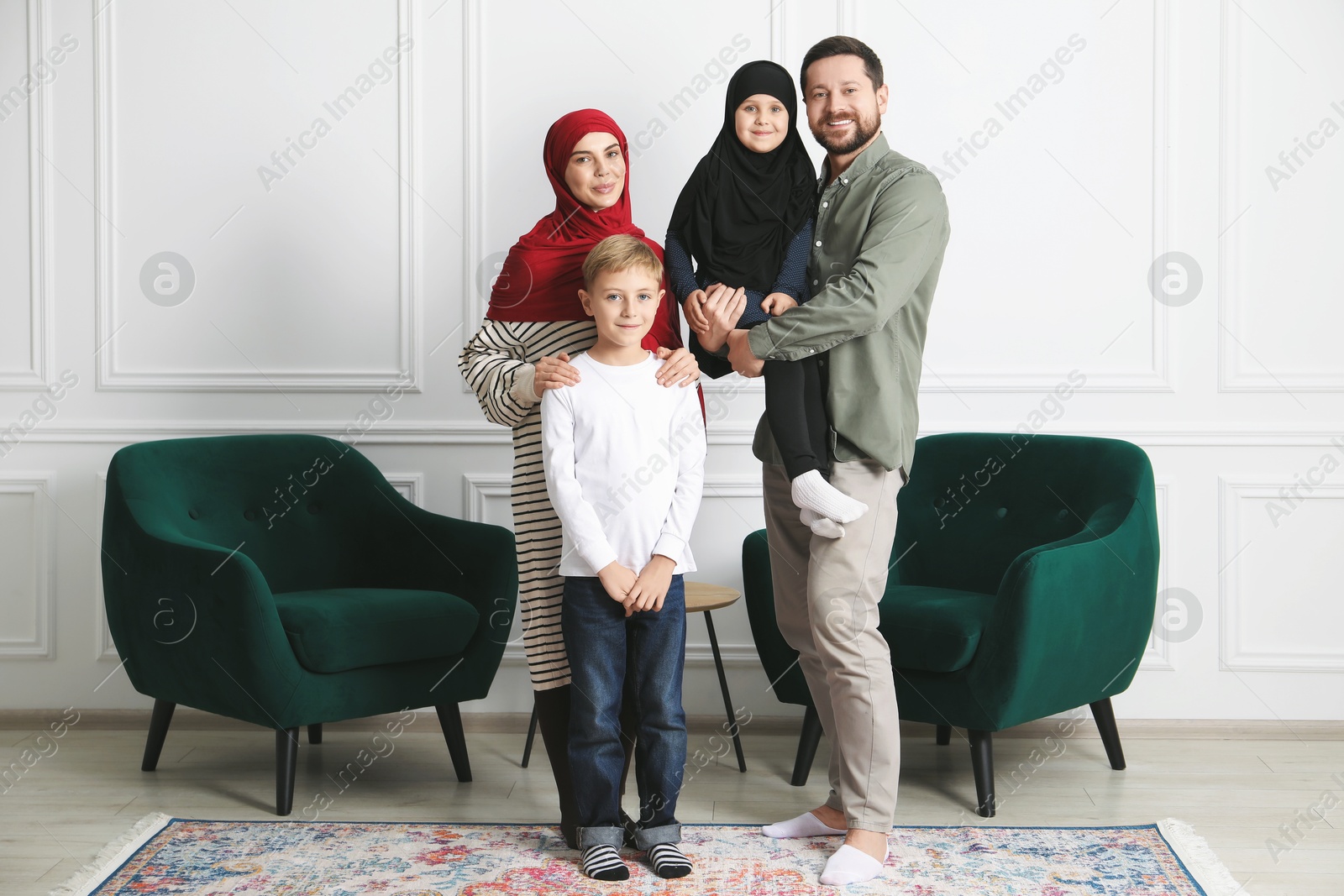 Photo of Happy Muslim family spending time together at home