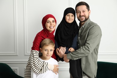 Photo of Happy Muslim family spending time together at home