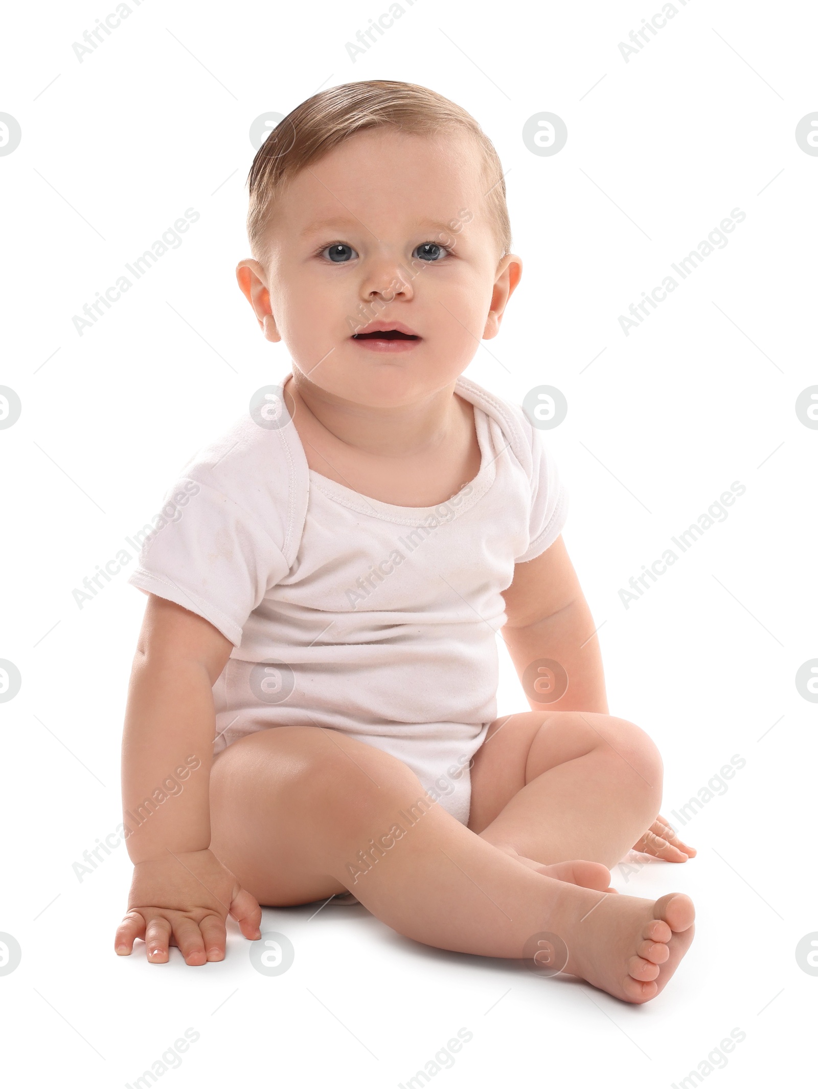 Photo of Cute little baby sitting on white background