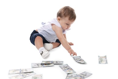 Photo of Little baby with money on white background