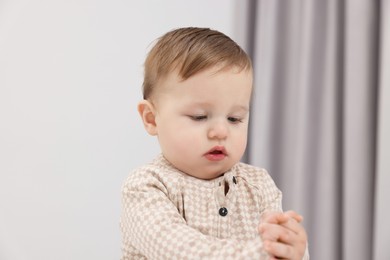 Photo of Portrait of sweet little baby at home