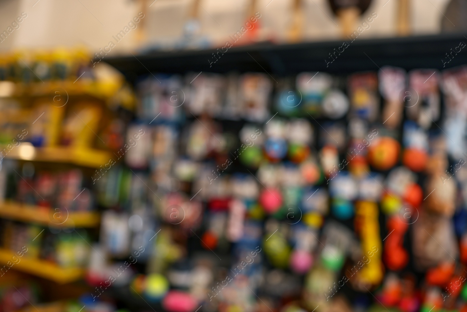 Photo of Blurred view of display with toys in pet shop