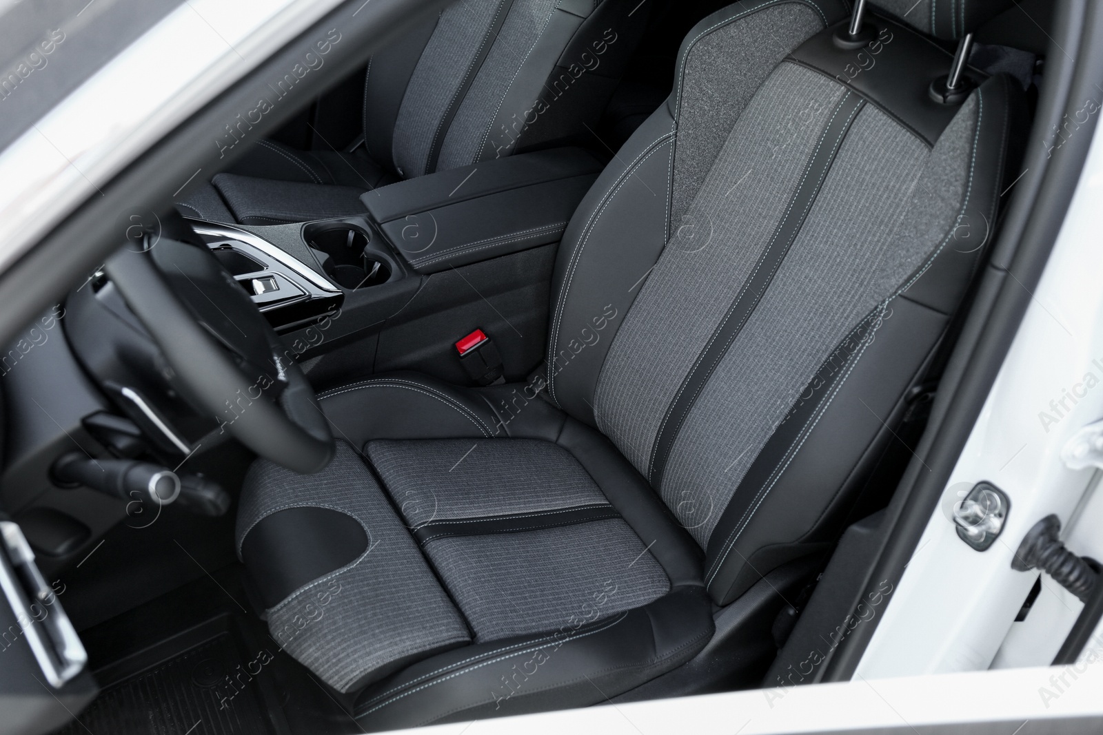 Photo of Comfortable seats inside of modern white car, closeup