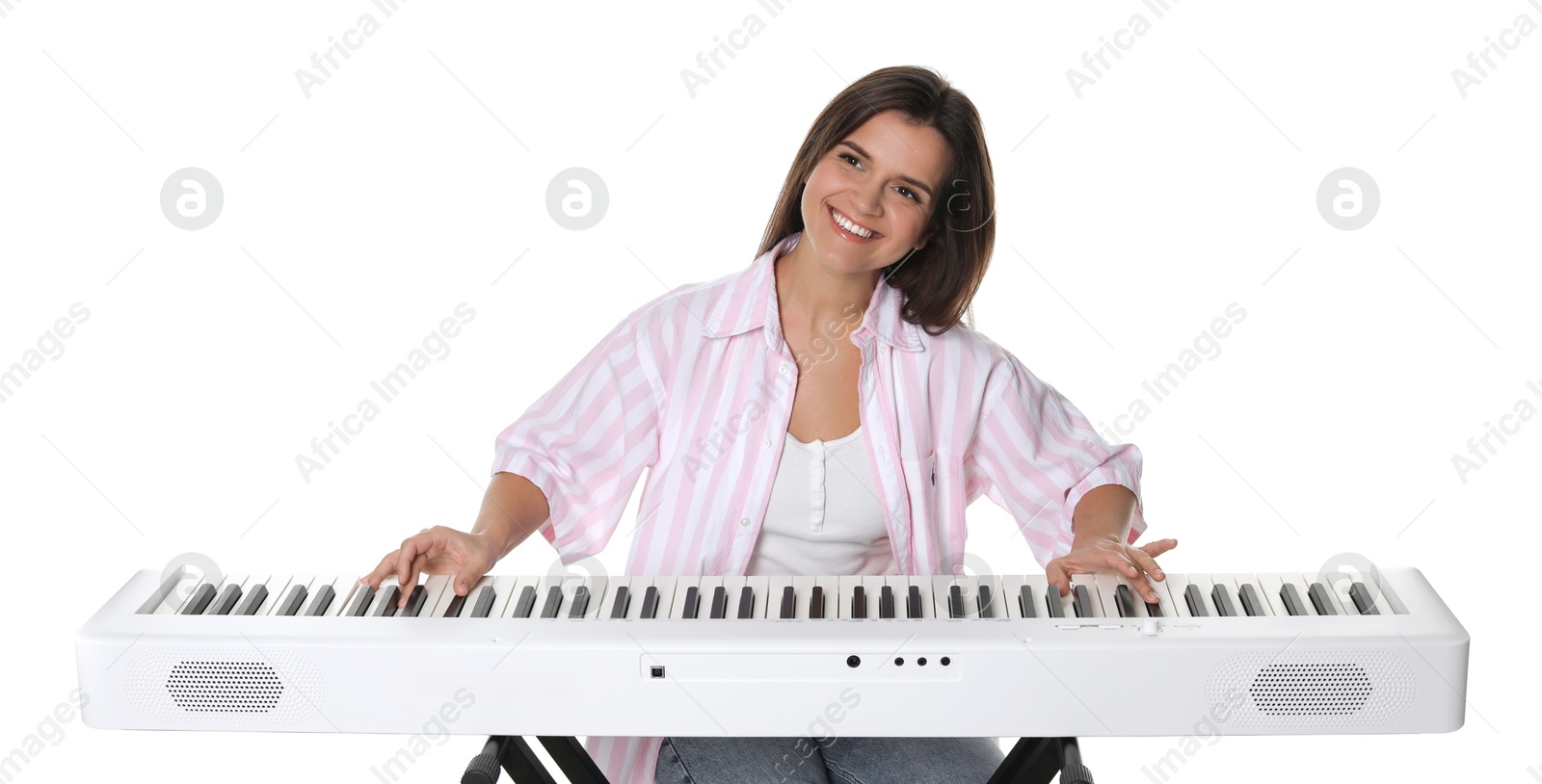 Photo of Smiling woman playing synthesizer on white background