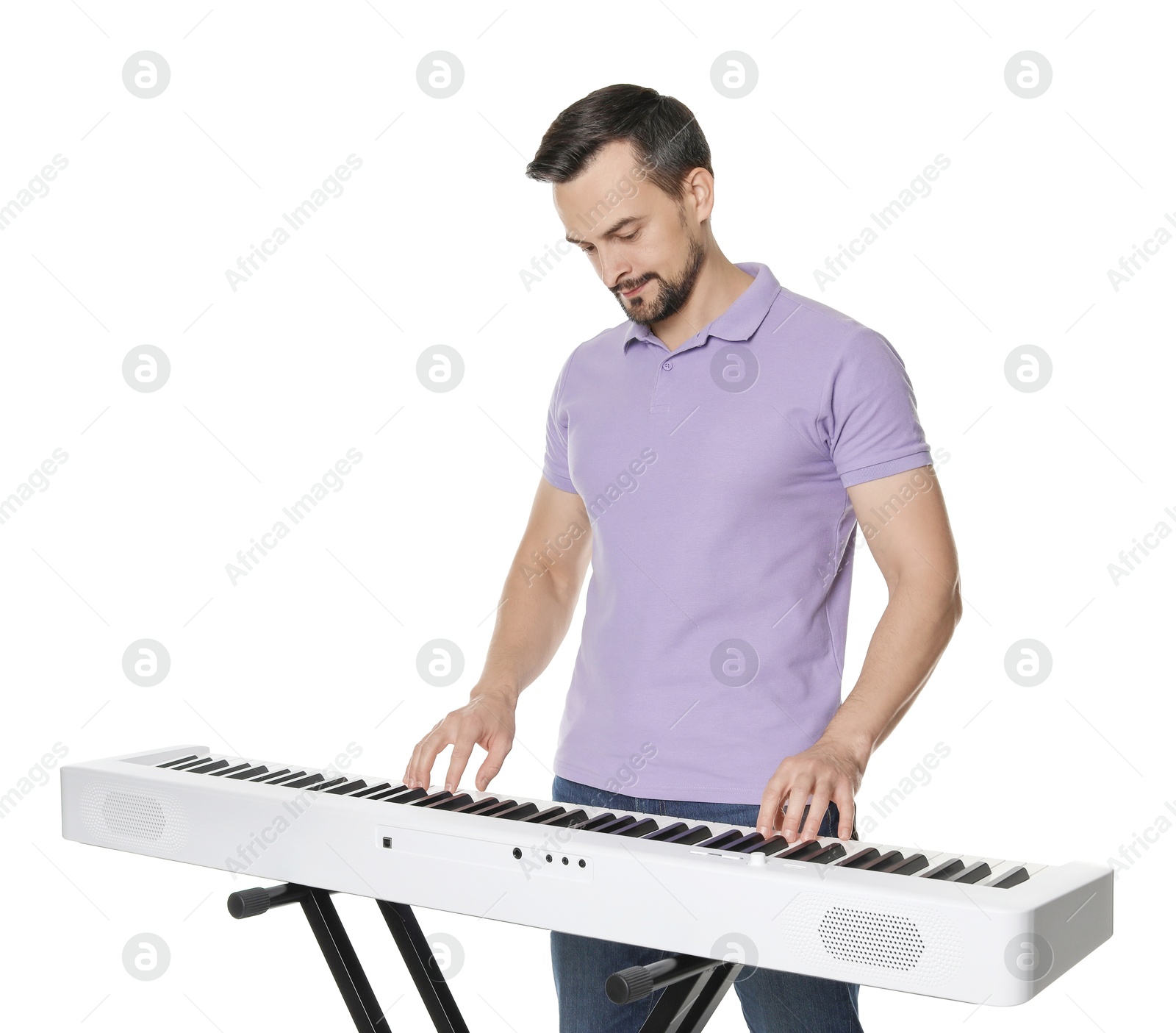 Photo of Bearded man playing synthesizer on white background