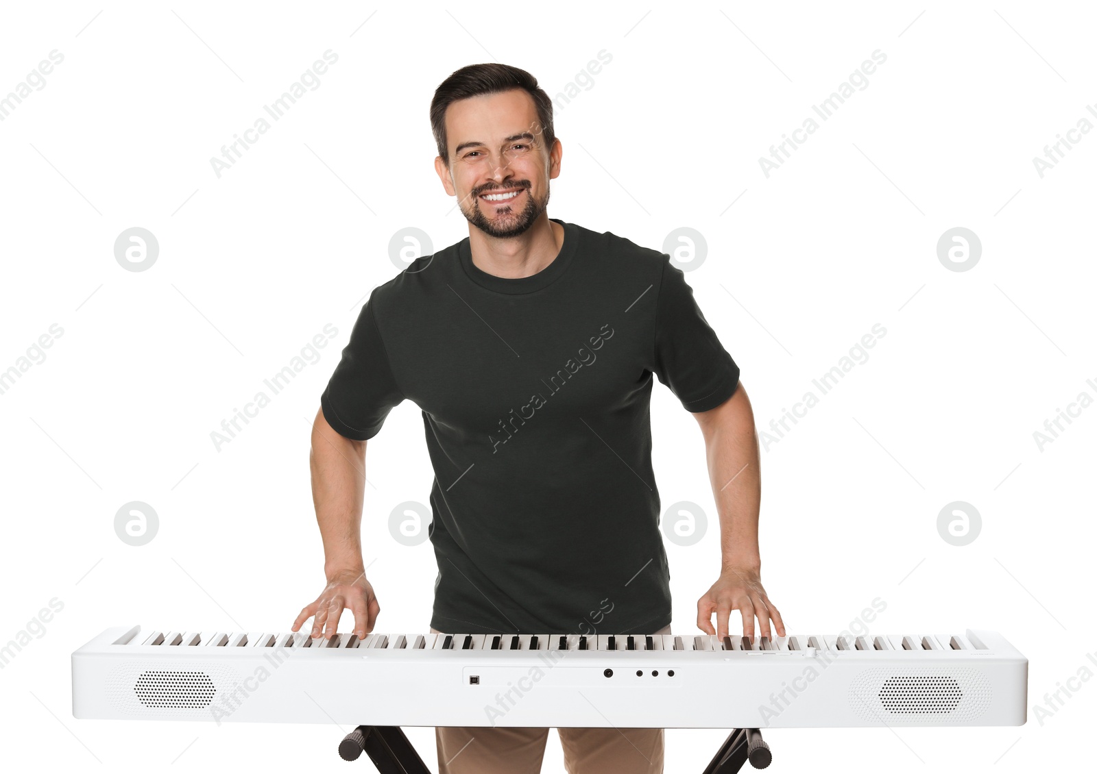 Photo of Smiling man playing synthesizer on white background