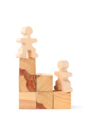 Photo of Human figures on wooden blocks against white background. Competition concept