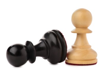 Photo of White pawn near fallen black one on white background. Competition concept