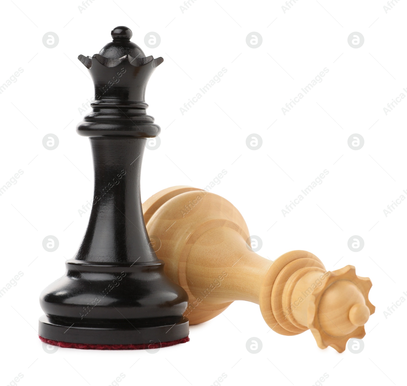 Photo of Chess queen near fallen one on white background. Competition concept