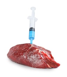 Photo of GMO concept. Piece of meat and syringe isolated on white