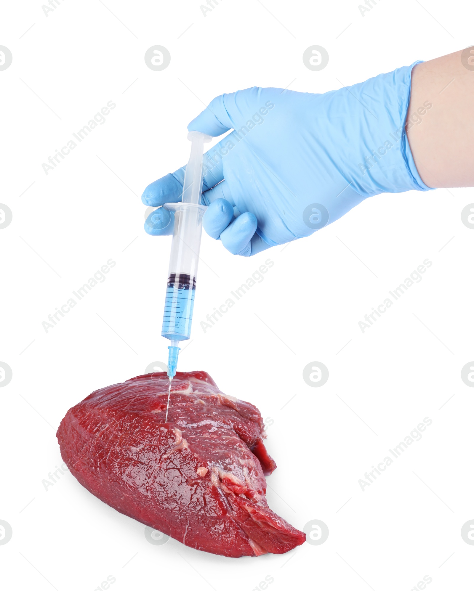 Photo of GMO concept. Scientist injecting something into piece of meat on white background, closeup