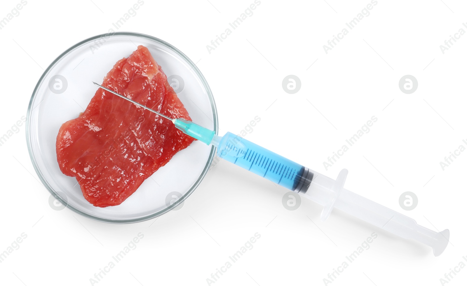 Photo of GMO concept. Piece of meat and syringe isolated on white, top view