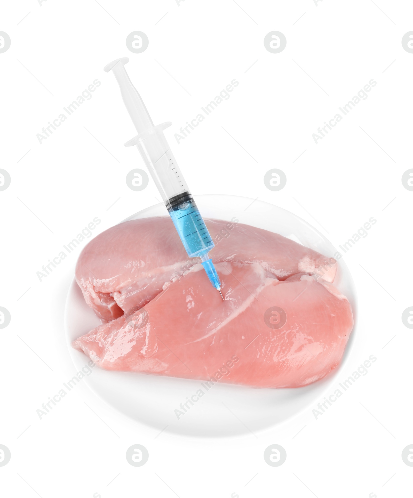 Photo of GMO concept. Chicken breasts and syringe isolated on white