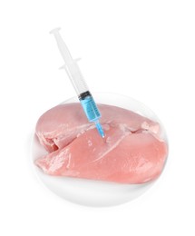 Photo of GMO concept. Chicken breasts and syringe isolated on white