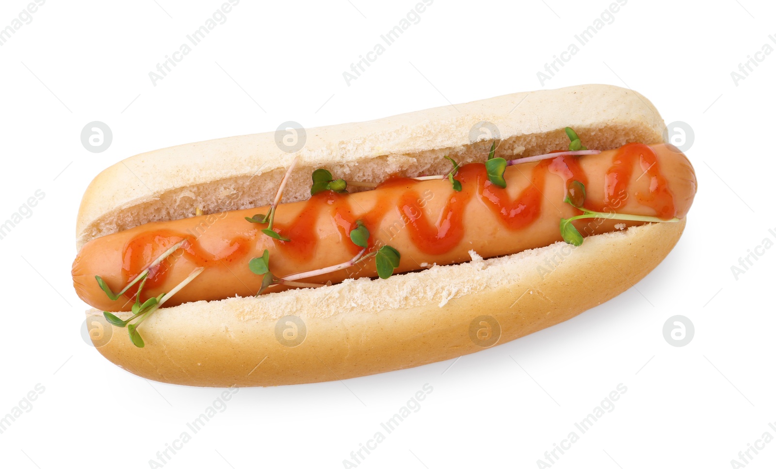 Photo of Tasty hot dog with ketchup and microgreens isolated on white, top view