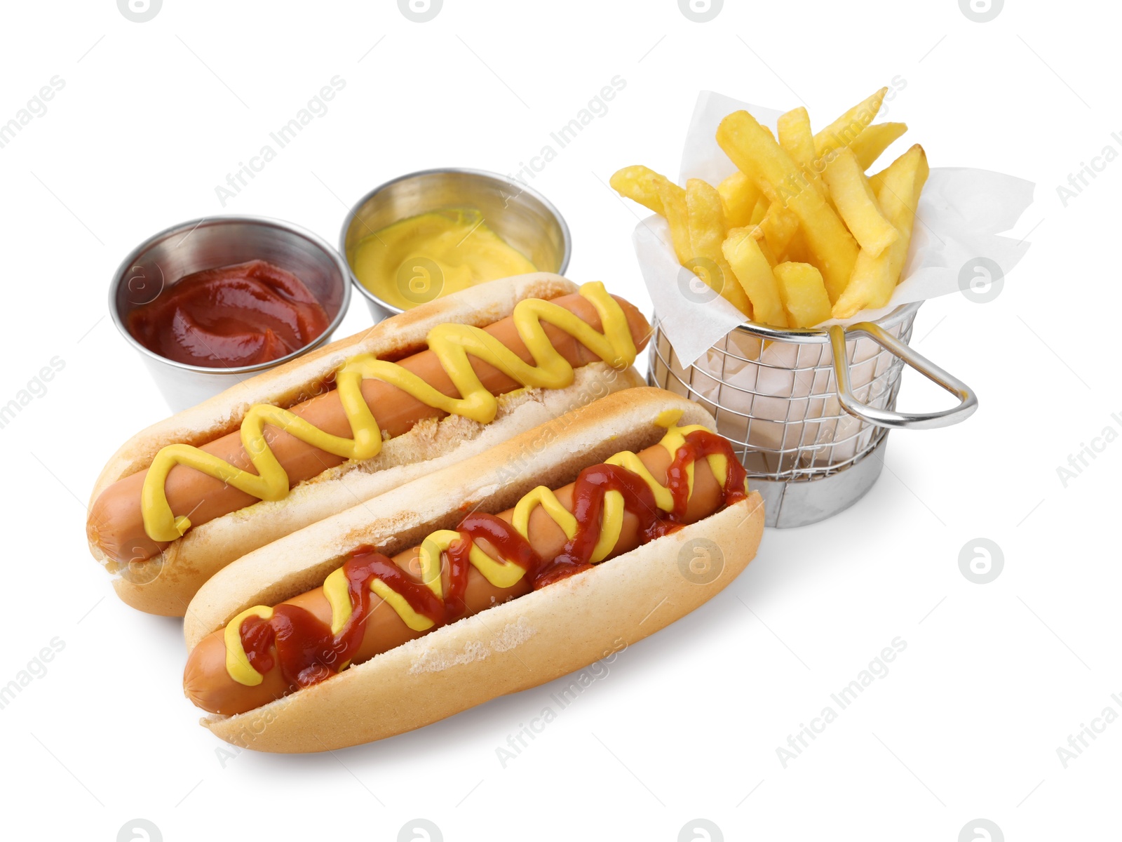 Photo of Tasty hot dogs with fries and sauces isolated on white